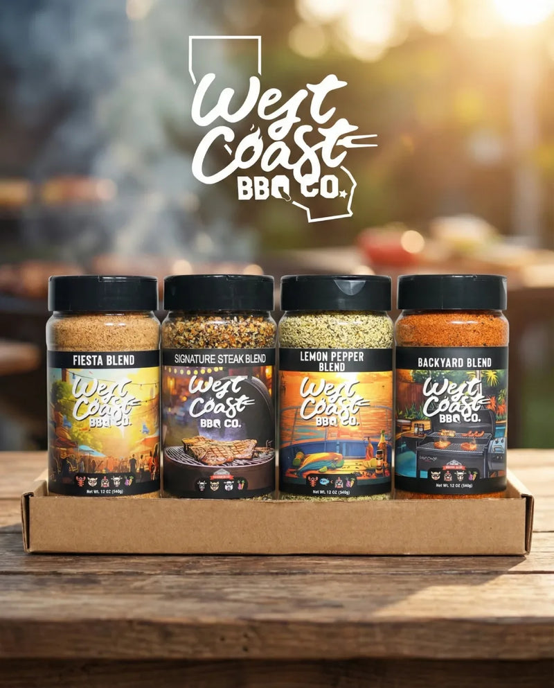 Four jars of West Coast BBQ Co. seasoning blends on a wooden surface with a blurred outdoor background.